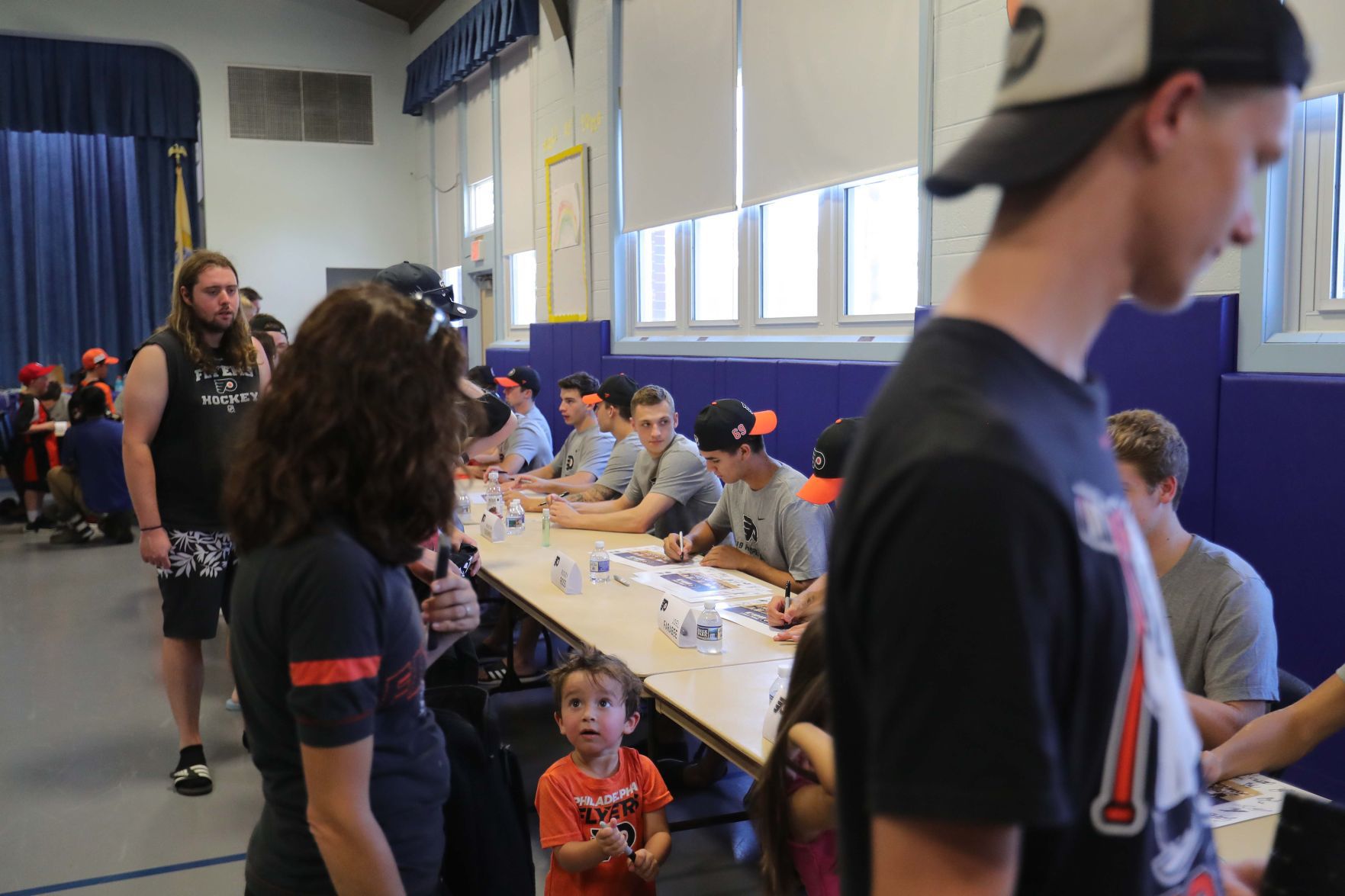 Philadelphia Flyers prospects sign autographs and play volleyball